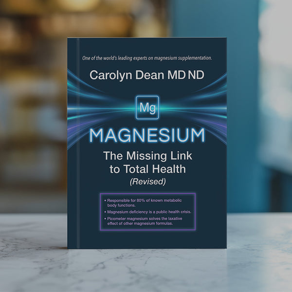 Magnesium: The Missing Link to Total Health (Revised) by Carolyn Dean MD ND, book standing on a marble counter