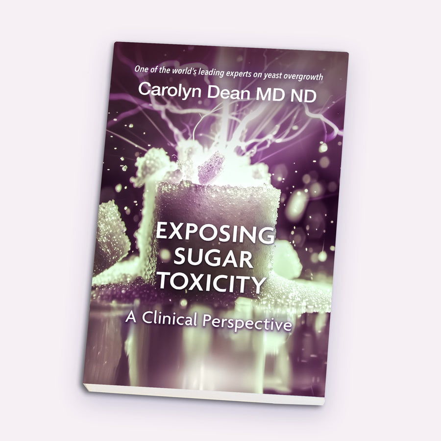 Exposing Sugar Toxicity: A Clinical Perspective by Carolyn Dean MD ND, book shown at an angle
